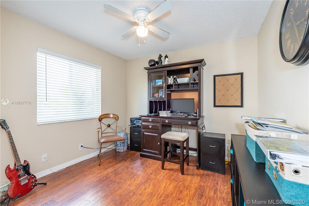Second bedroom with wood laminate floors.