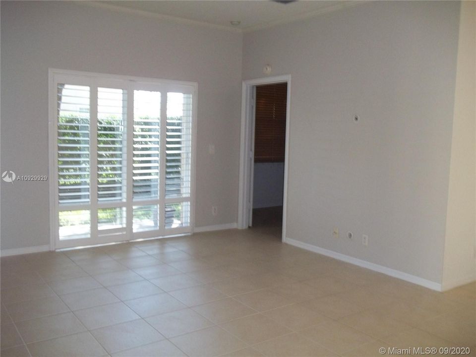 Living Room w/plantation shutter on slider.