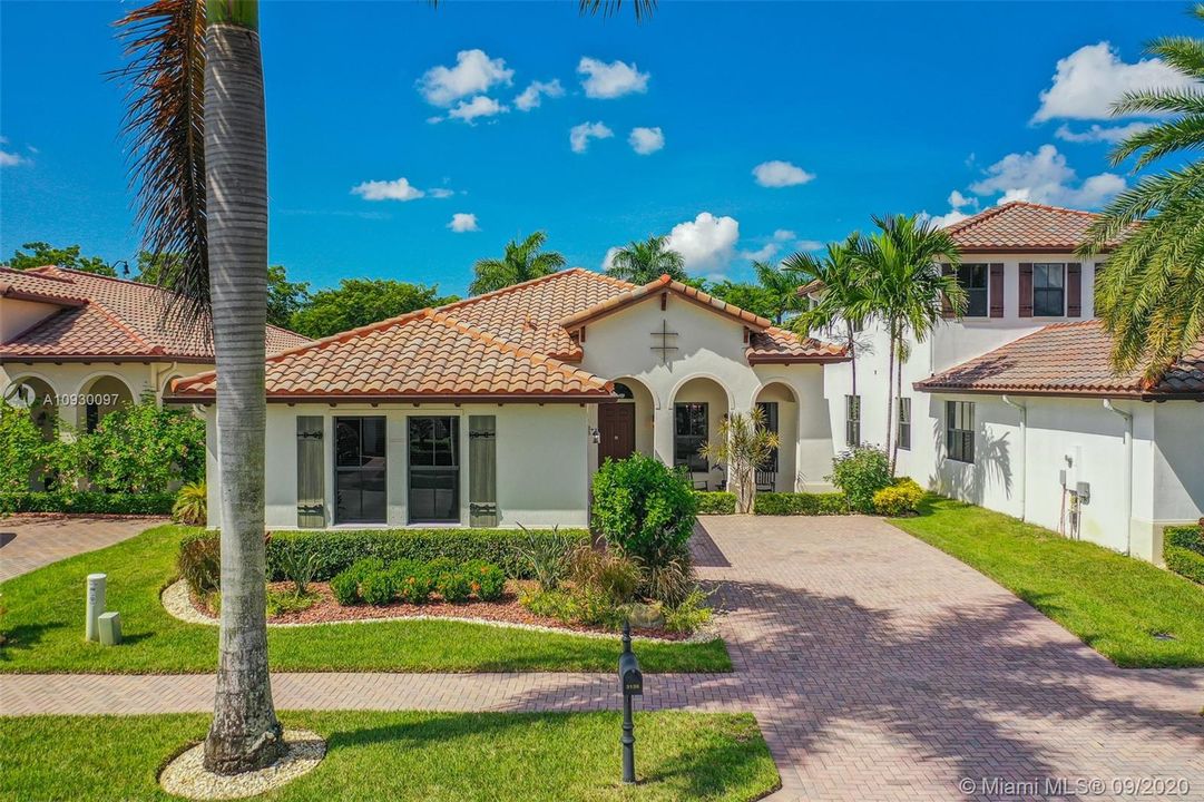 Exterior front, beautifully landscaped