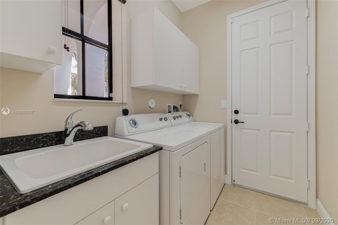 Laundry room with full size washer and dryer , door to garage