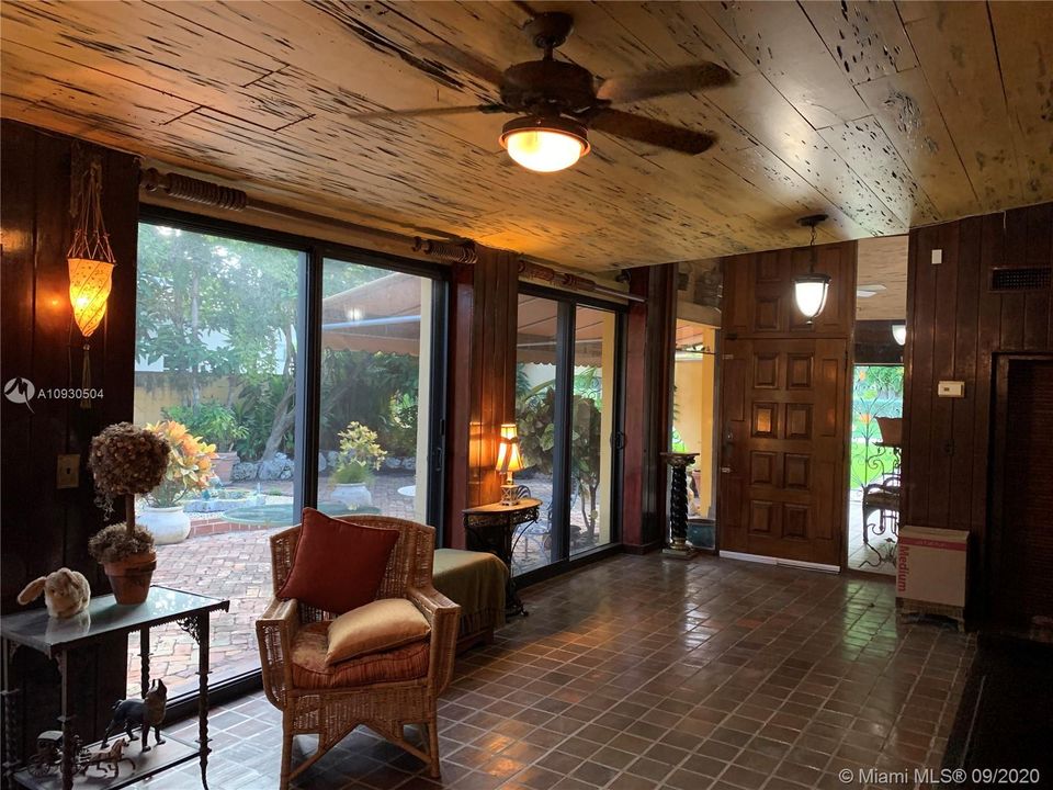 Entry Room with View of Private Front Courtyard, Solid Wood Front Door with Pecky Cypress Ceiling.