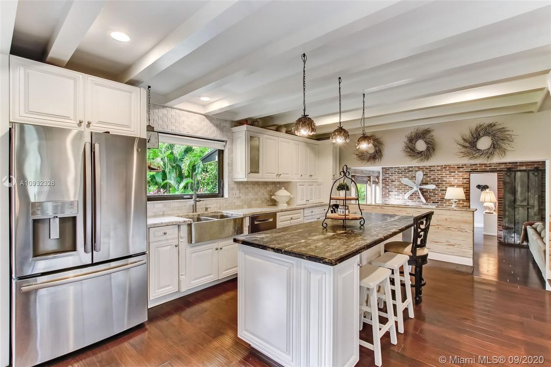 The best family conversations happen in the kitchen - treasure them around this 9 foot island with leathered granite.