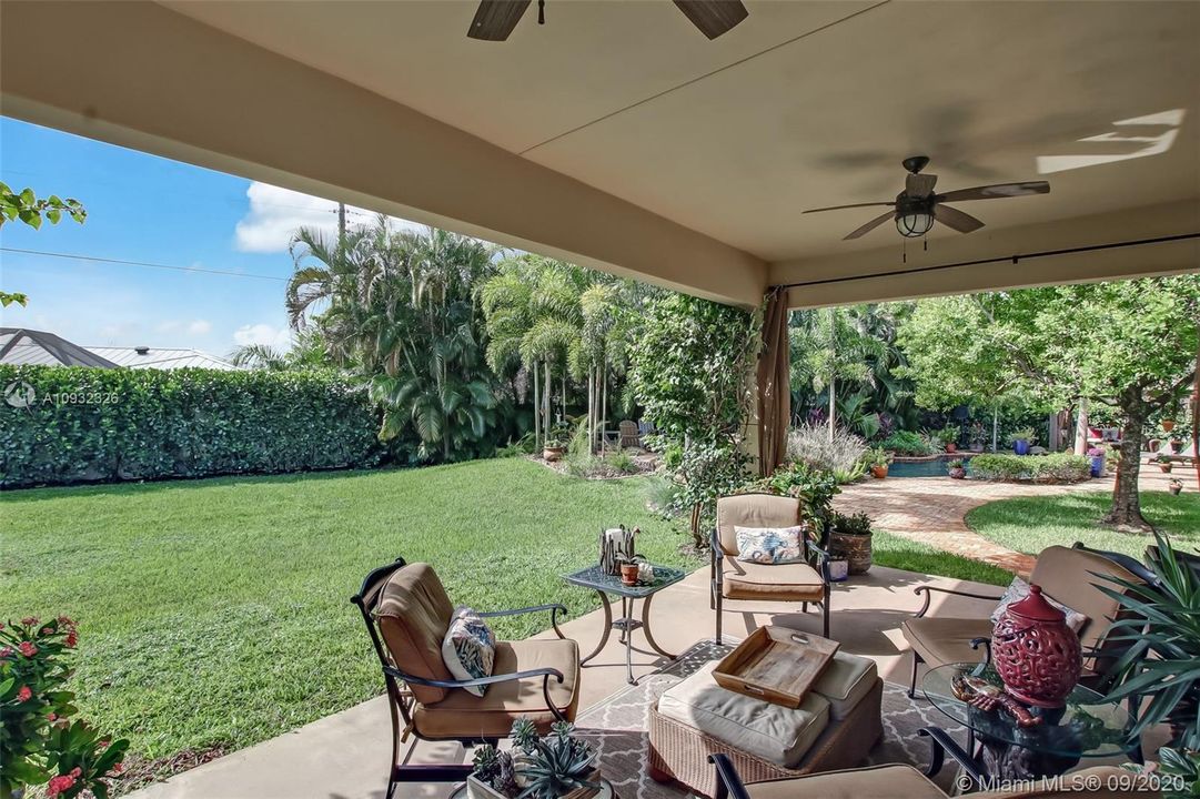 Guest house patio overlooking expansive fenced backyard and a short walk to the pool.