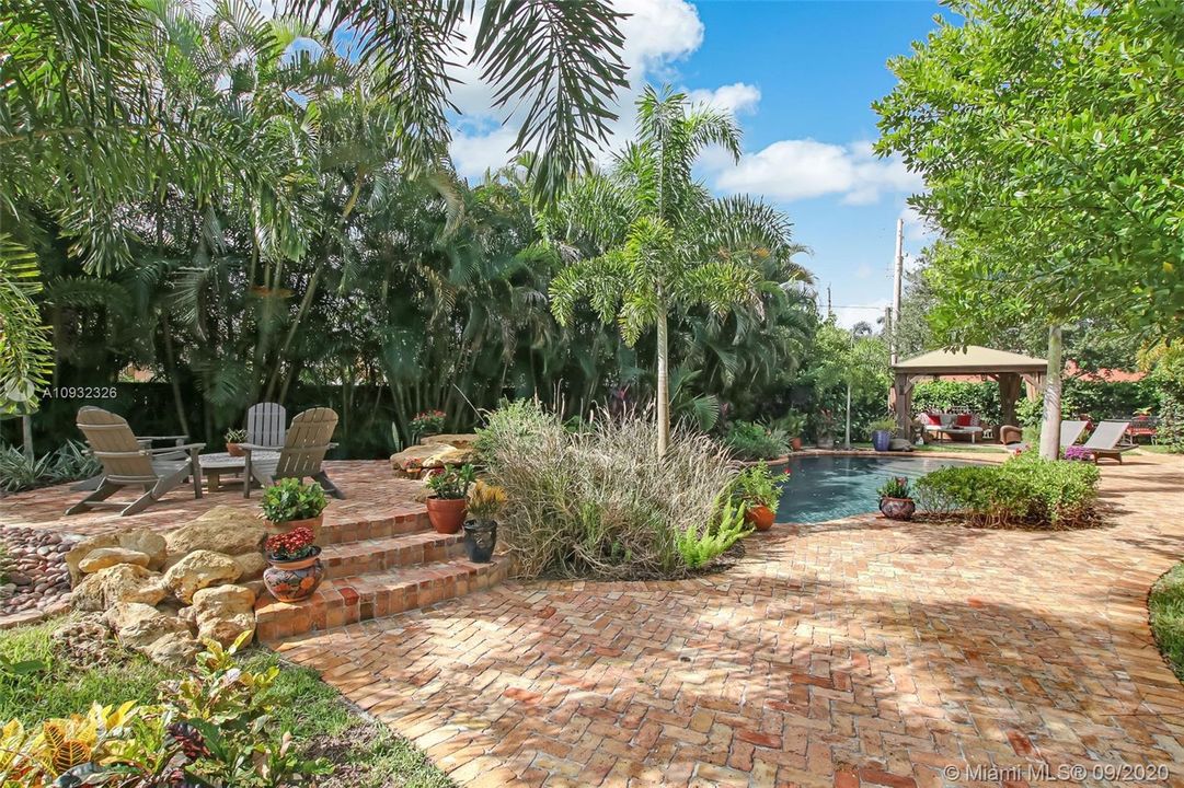 Expansive use of brick pavers in the resort style private backyard.