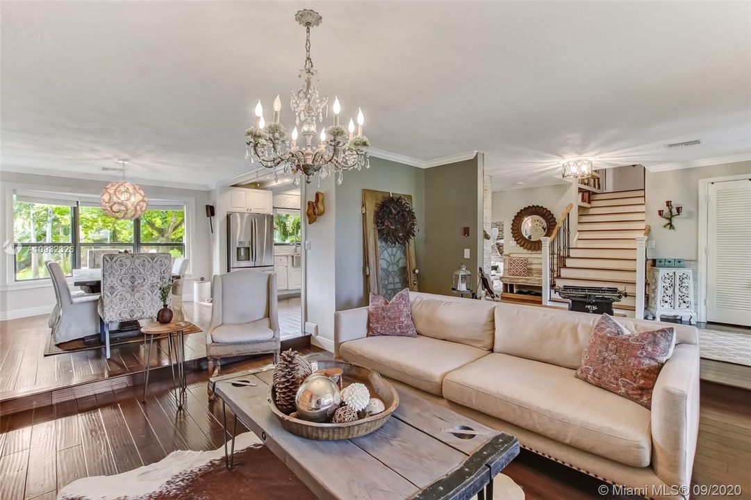 Living room opens to formal dining room and foyer.