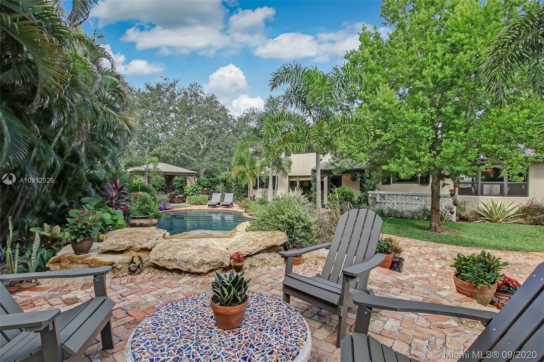 Raised Chicago brick patio area surrounded by a Zen-like landscaped retreat.