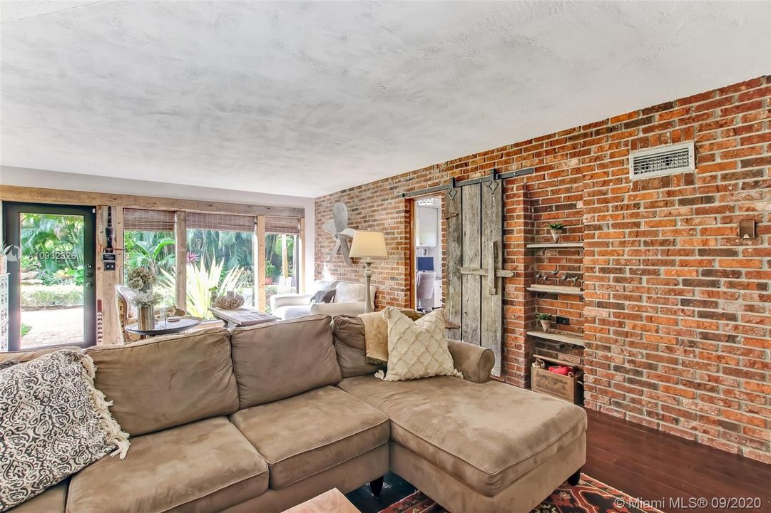 Family room - note the 100 year old barn door leading to the office/5th bedroom with it's own full bath.