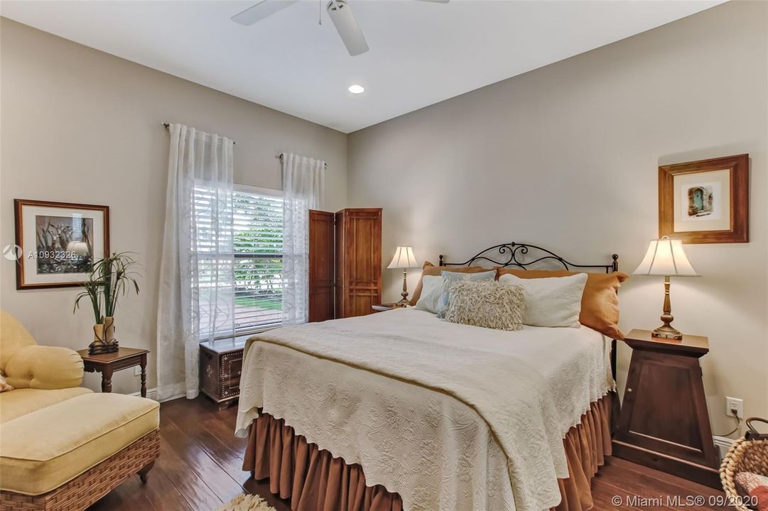 Second bedroom in guest house has oversized closet with built-in storage.