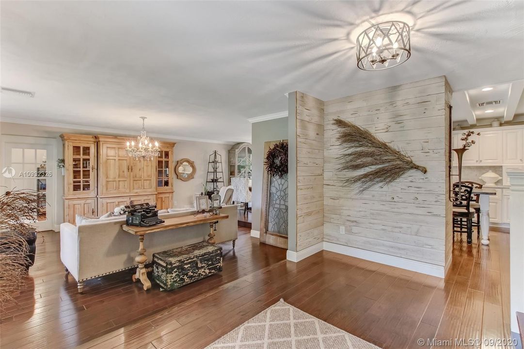 Foyer opens to spacious living room and kitchen.