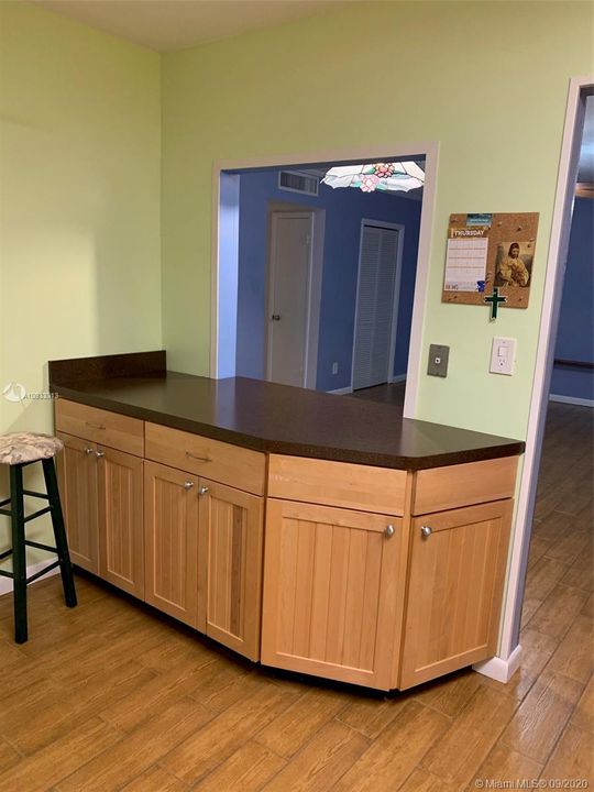 kitchen bar leading to pass thru to living area