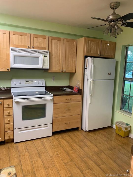 kitchen with tile wood look floors thru out unit