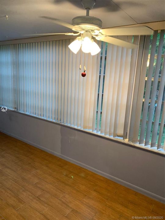 enclosed florida room with lots of windows