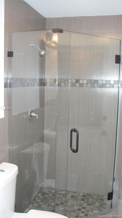 CABANA BATH WITH CUSTOM GLASS ENCLOSURE