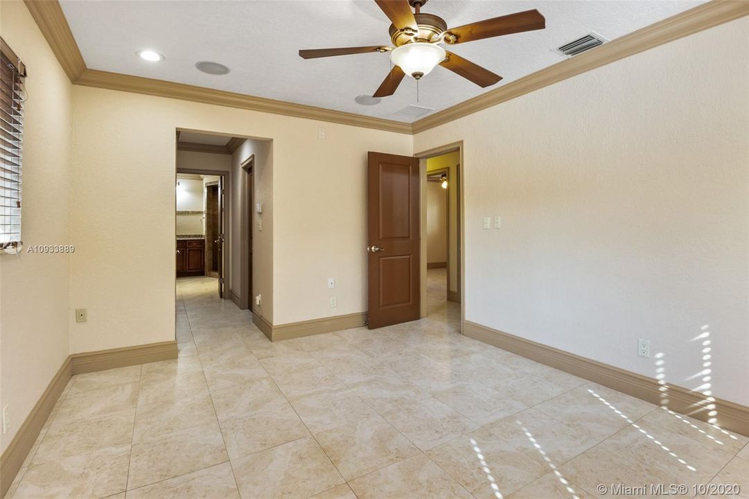 Master bedroom with his and hers closets
