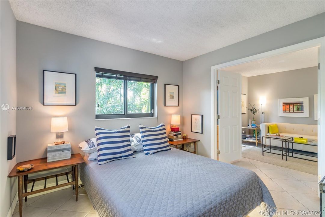 Primary bedroom with double door entry