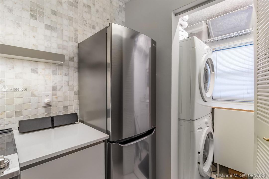 Sleek LG fridge & front loading washer & dryer