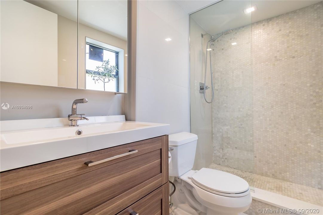 New bath with walk-in shower & glass enclosure