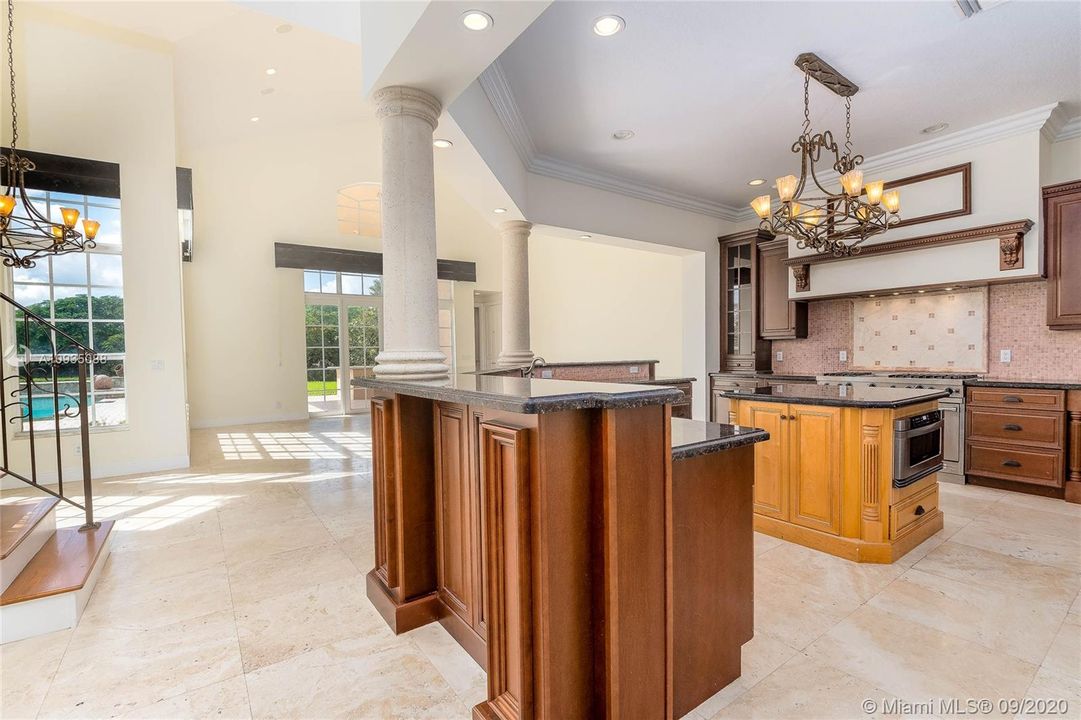 GOURMET KITCHEN OPEN TO FAMILY AND BREAKFAST ROOM - EASY ACCESS TO 2ND FLOOR THROUGH SECONDARY STAIRCASE.