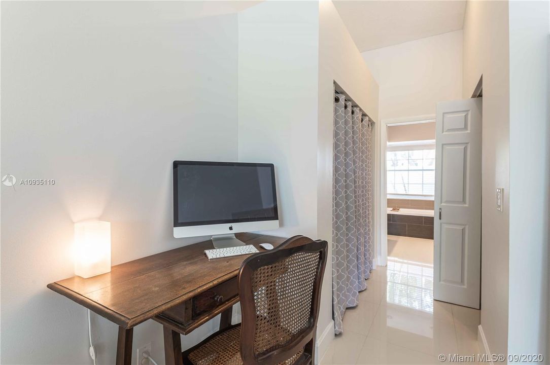 view of the hallway leading to the walking closet and primary bathroom