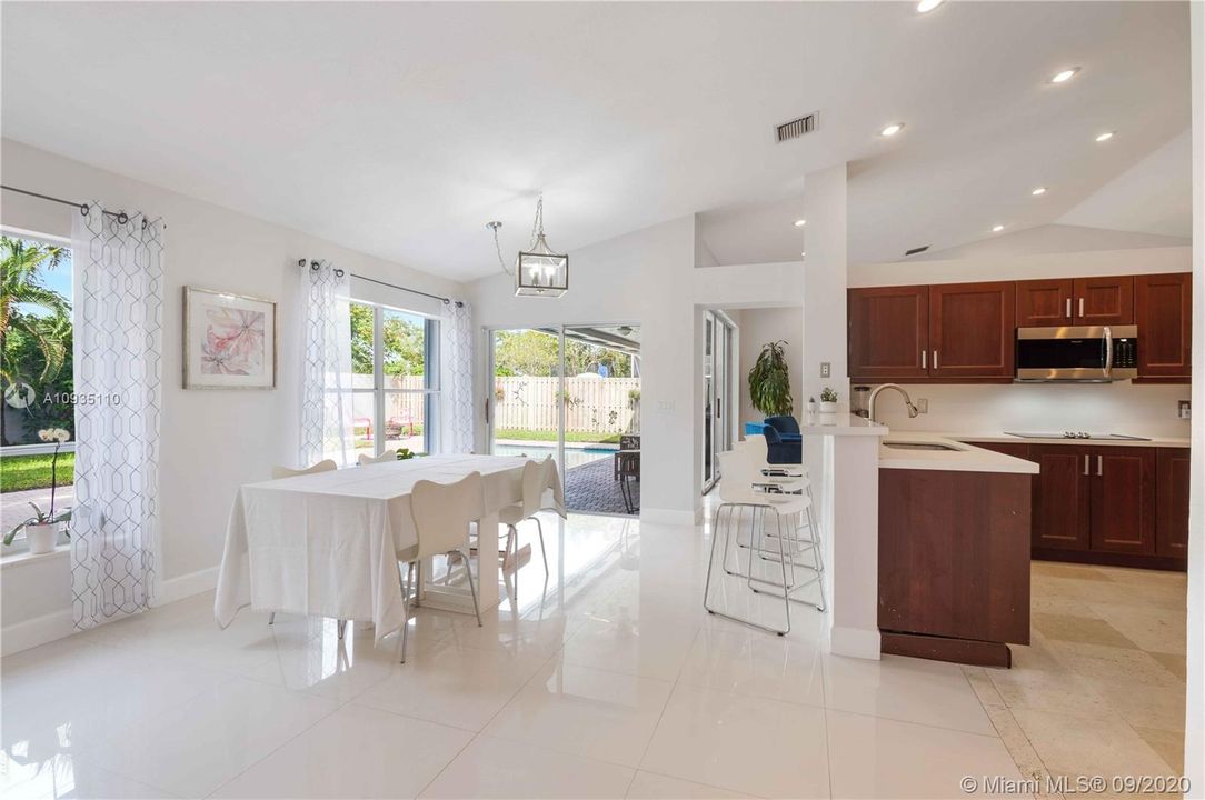 View of the dining room and glimpse of the backyard