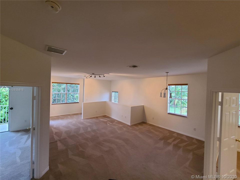 Looking at Living Room from Kitchen.  The Master Bedroom and Office can be seen (3rd Bedroom)