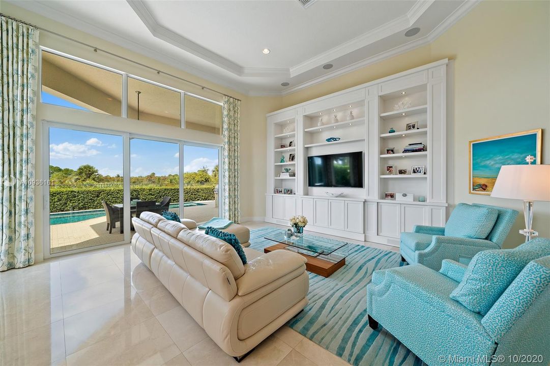 Family  room looking at pool and preserve