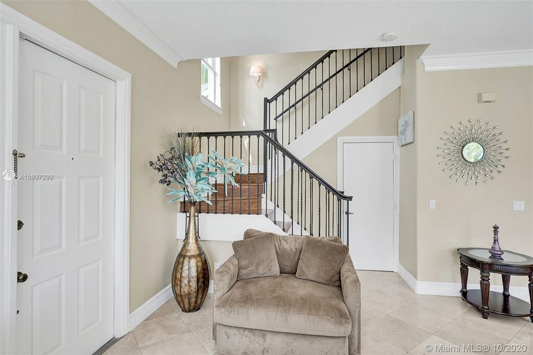 STAIRS TO SECOND FLOOR LEFT OF FRONT DOOR ENTRY