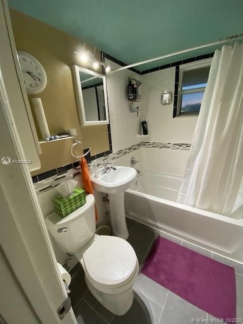 Bathroom is well lit, fixtures are comfortably spaced; very functional space.