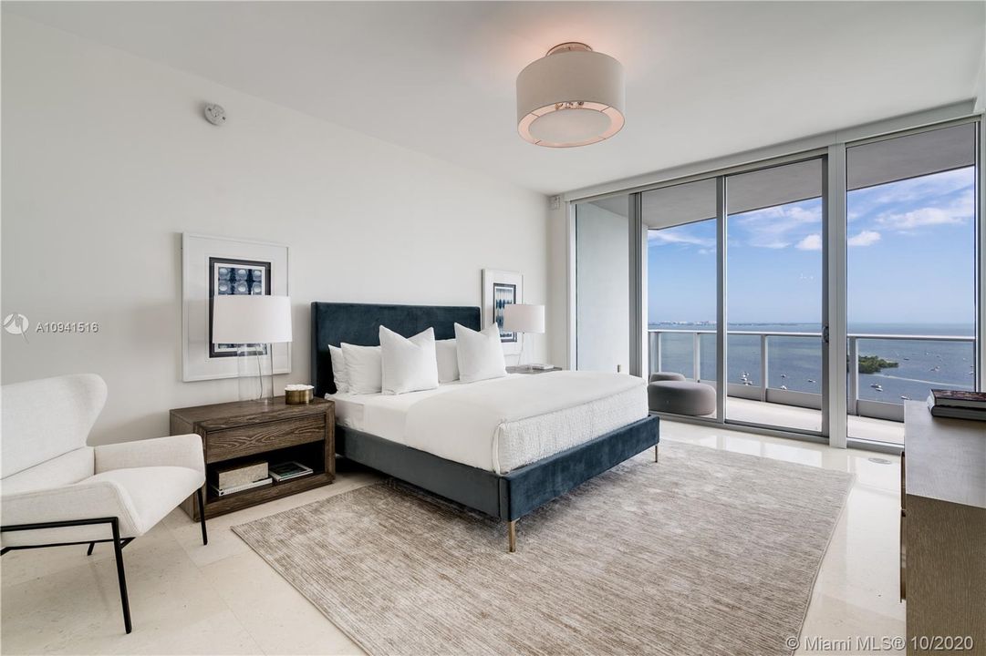 Primary bedroom with sweeping water views