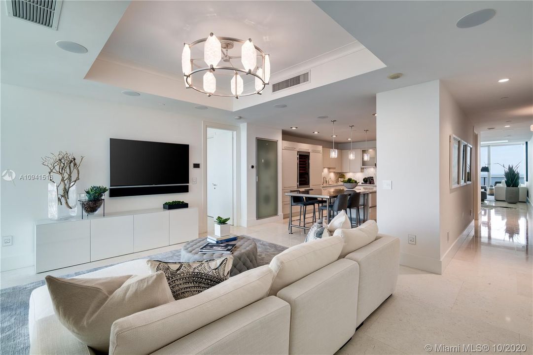 Family room with access to balcony and kitchen