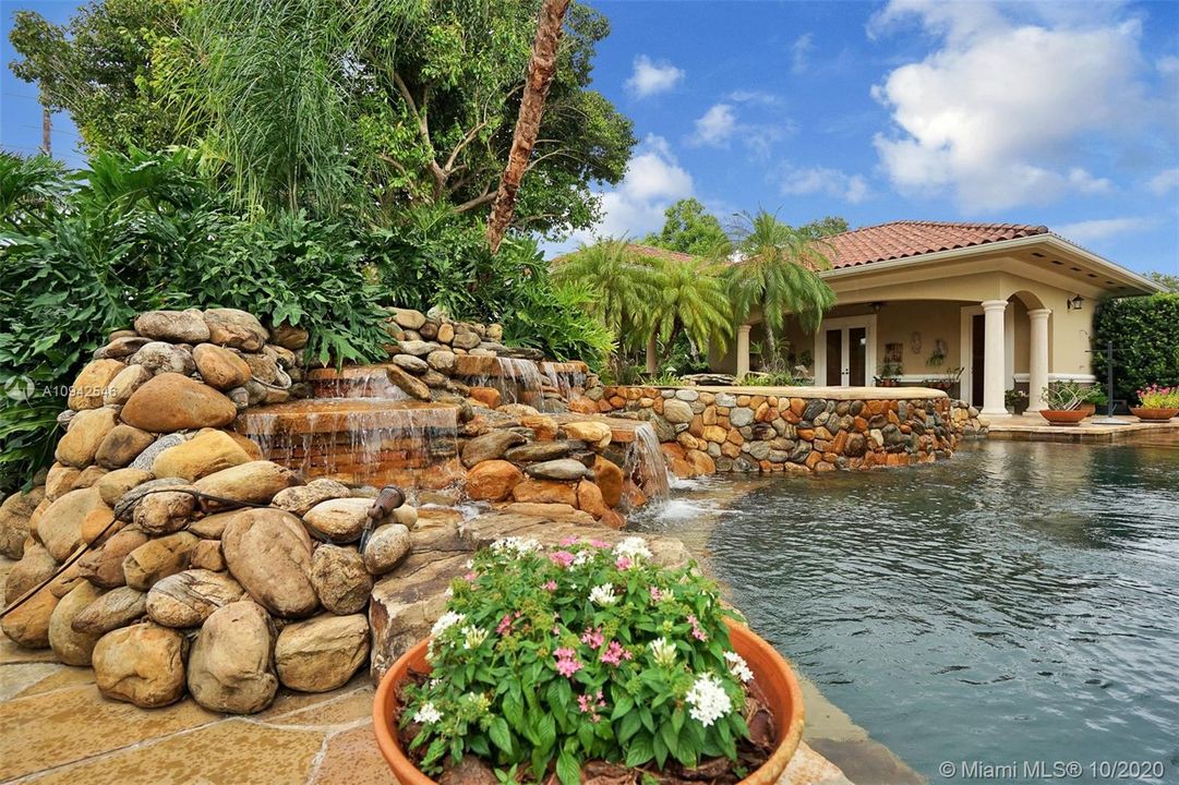 Natural river stones enhance the pool area