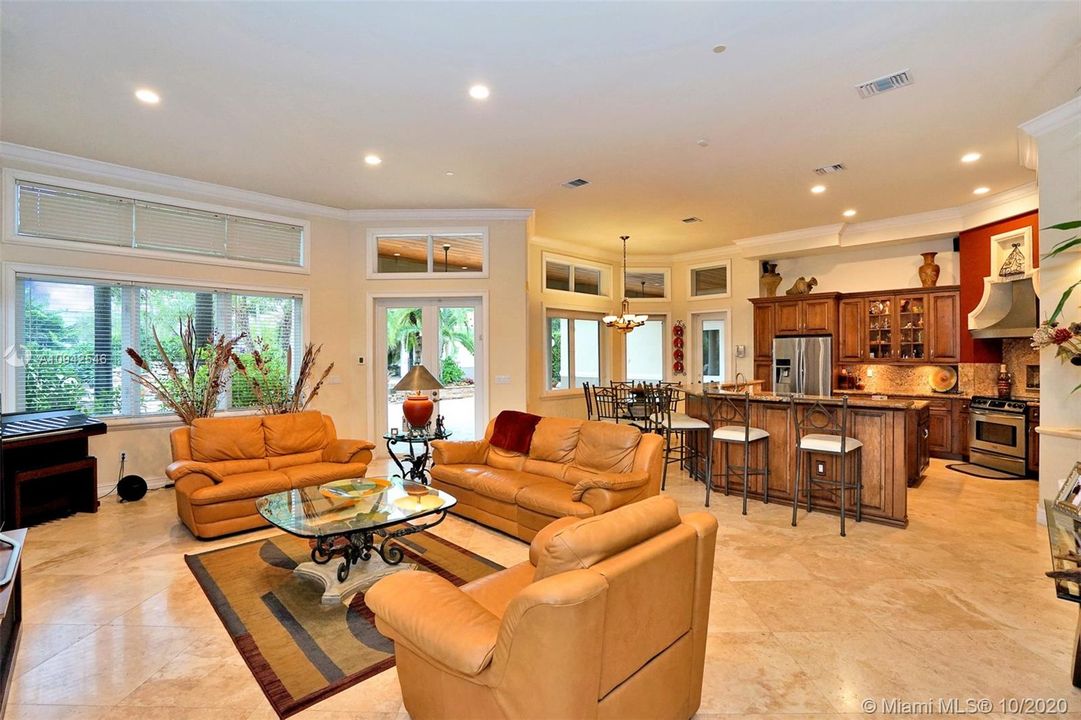 Spacious entertainment room adjacent to the kitchen
