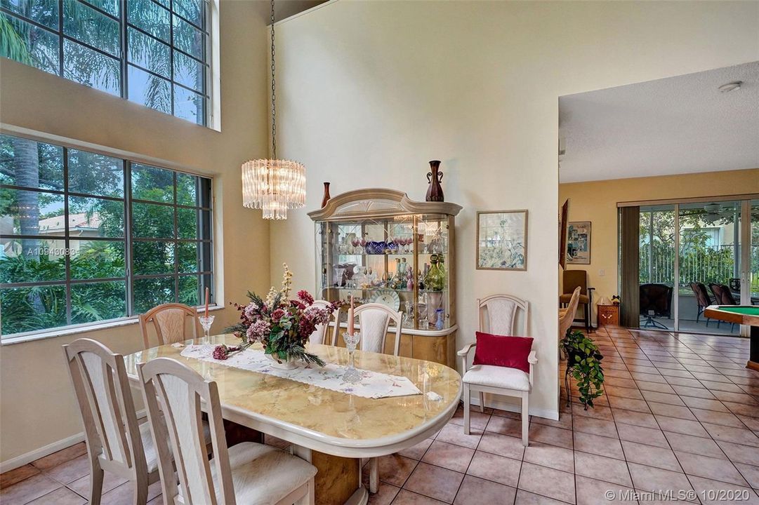 Living room/dining room with sunlight throughout.