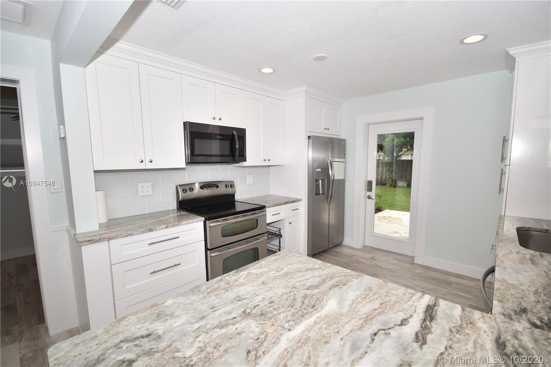 Renovated Kitchen with all wood cabinets & Granite Counter tops