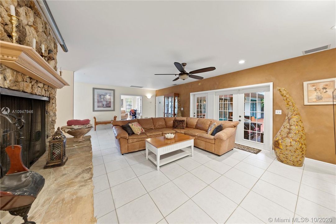 LARGE FAMILY ROOM W/ FRENCH DOORS LEADING TO THE OFFICE.