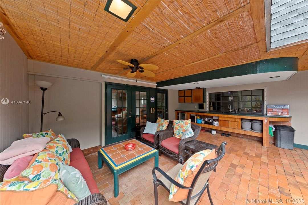 RESORT STYLE PATIO W/ SINK, BEVERAGE REFRIGERATOR, EXTERIOR LIGHTING, BEAUTIFULLY PAVERED.