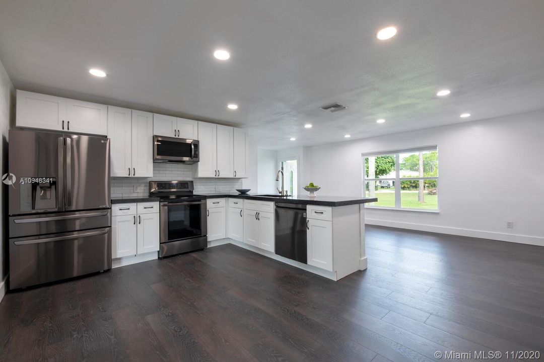 KITCHEN- Wood Shaker Cabinets, LG appliances, Concrete Counter Tops, Waterproof Wood-Look Floors