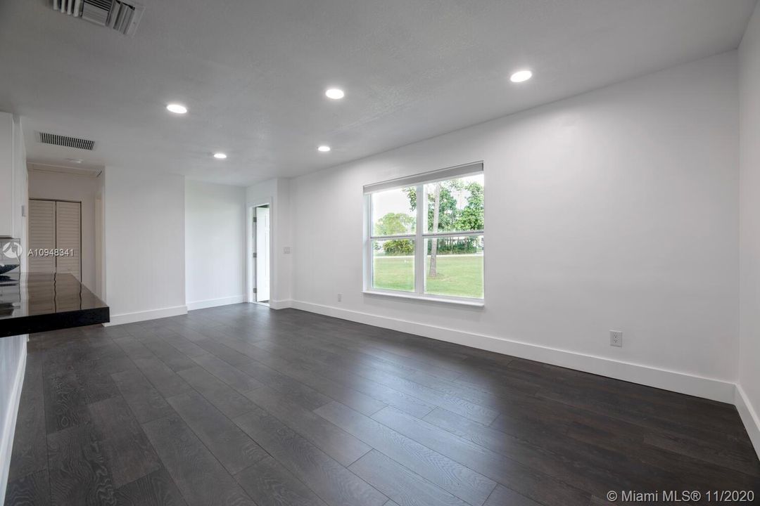 View from kitchen to front entrance, Recessed lighting in kitchen and living area.