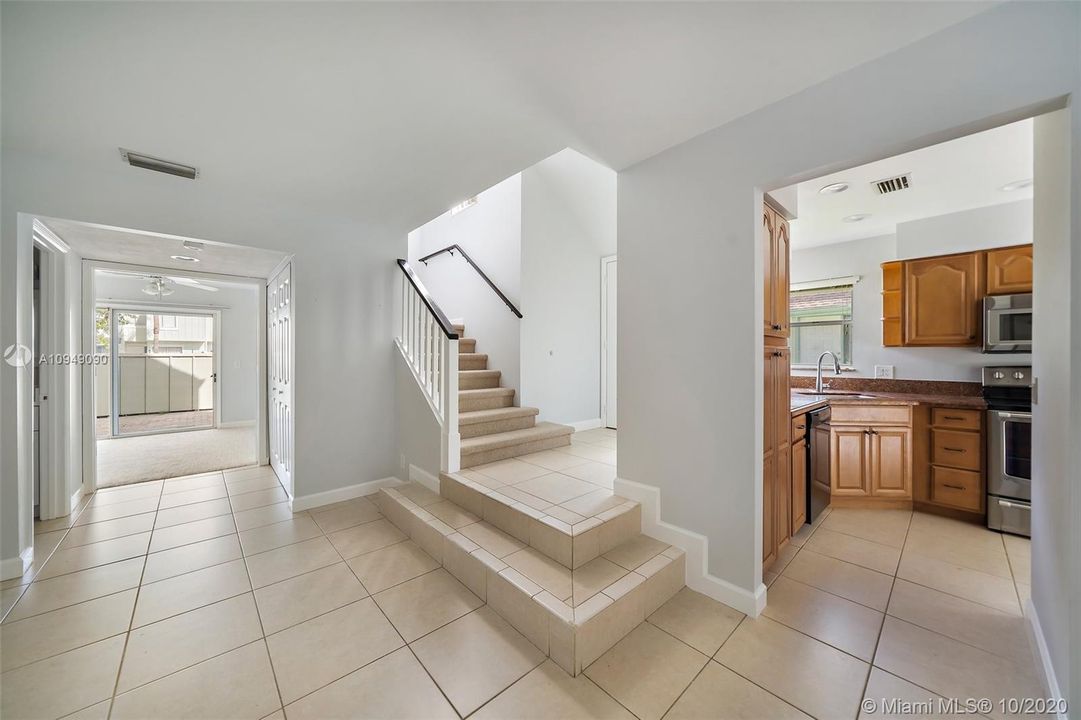 Entryway leading to Kitchen, 3rd Bedroom, 1/2 Bath and 2nd Floor