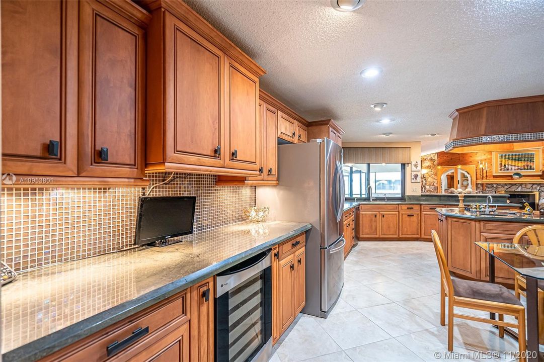 Dream kitchen with all of the solid wood cabinets that you could ever dream of