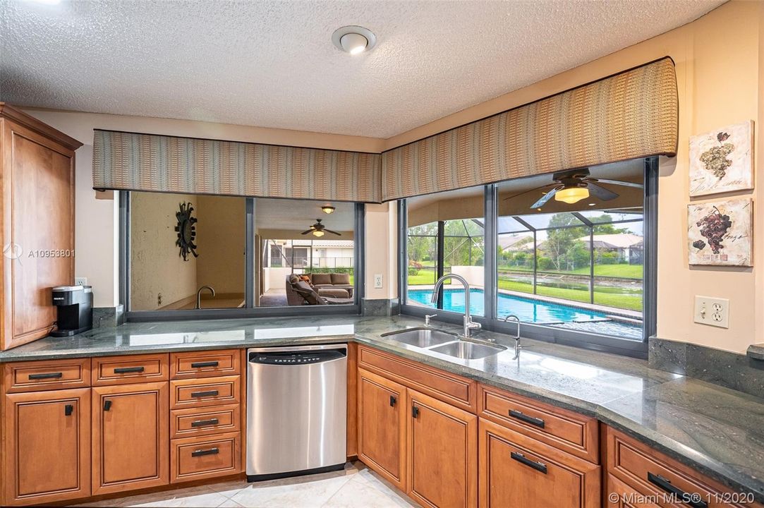 Fabulous custom gourmet kitchen with great pool & water views