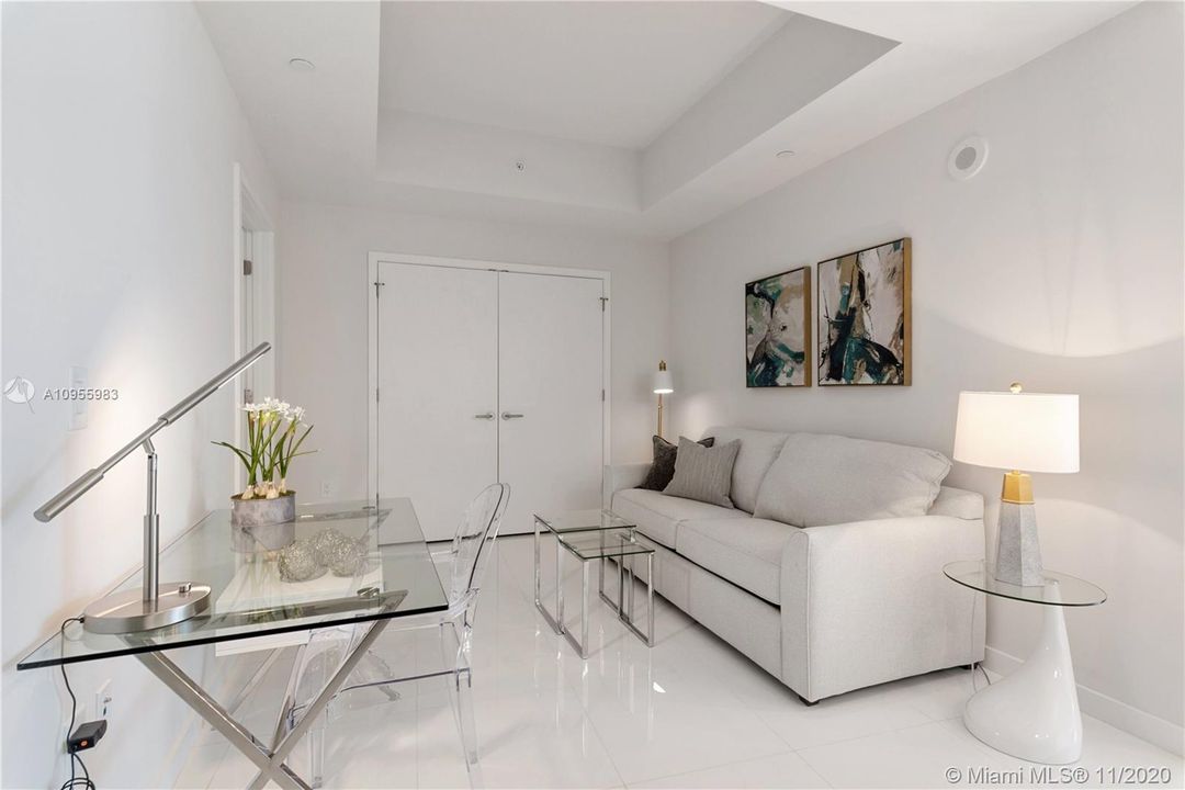 Den with en-suite bath, custom closets and sleeper sofa.