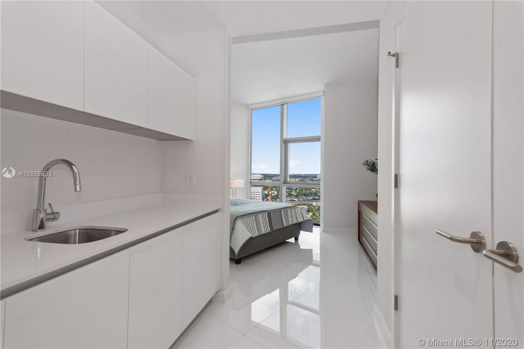 "Lockout" bedroom with private entrance directly to foyer/elevator  +   a kitchenette +  en-suite full bathroom.