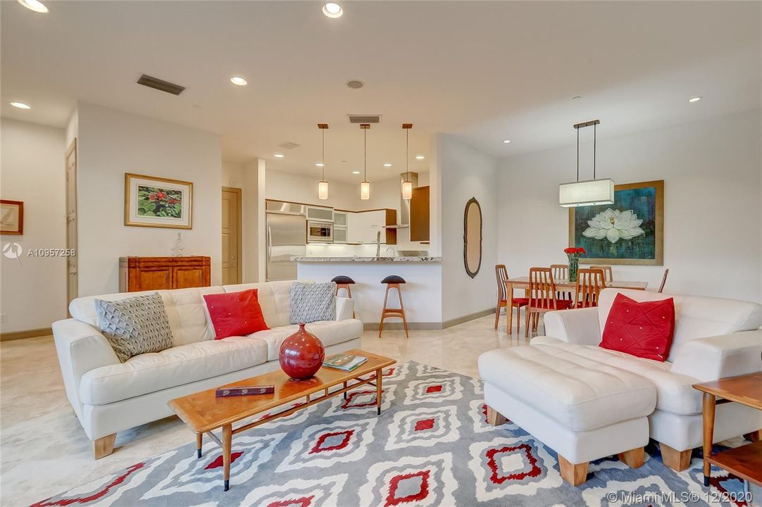 Open concept living space on first floor. Marble Floors, High Ceilings