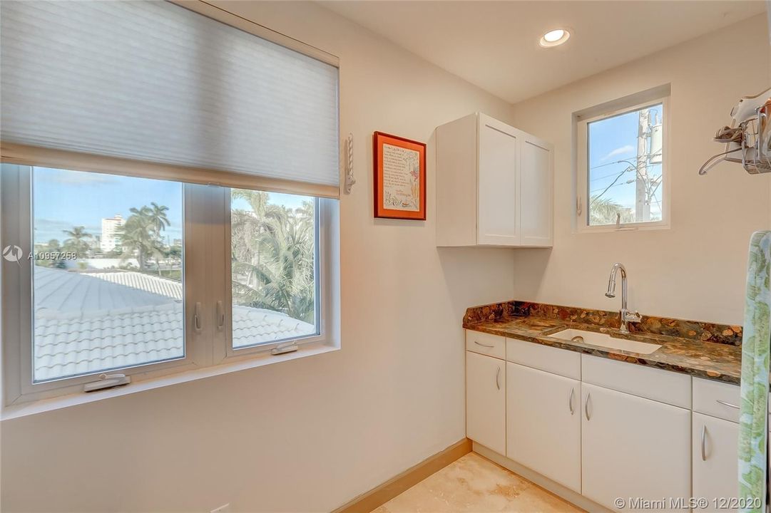 Large, bright Laundry Room w/ Sink, Storage w/ Stone Counters & Marble Floors