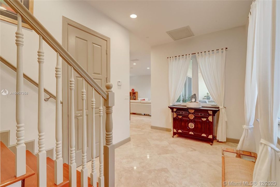 Foyer w/ Powder Room & Elevator behind