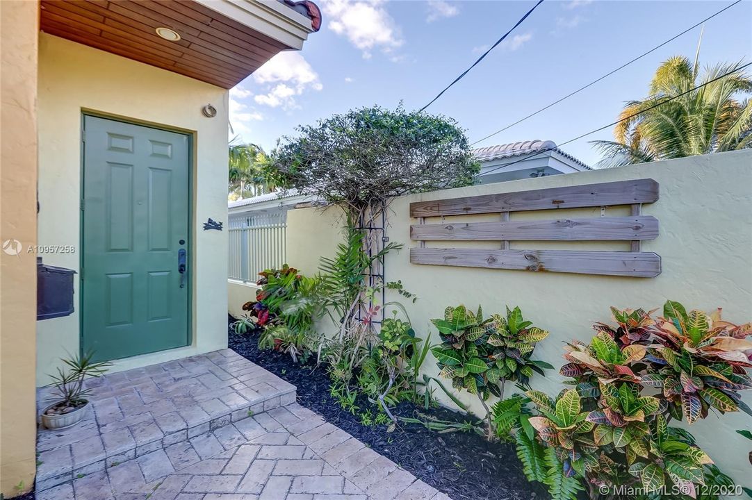 Inviting entrance w/ T&G Wood overhang