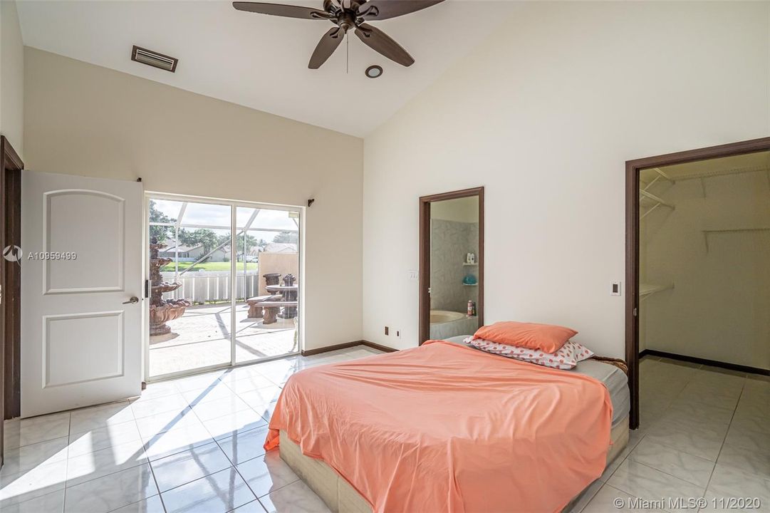 Master Bedroom with View to Patio and Lake.