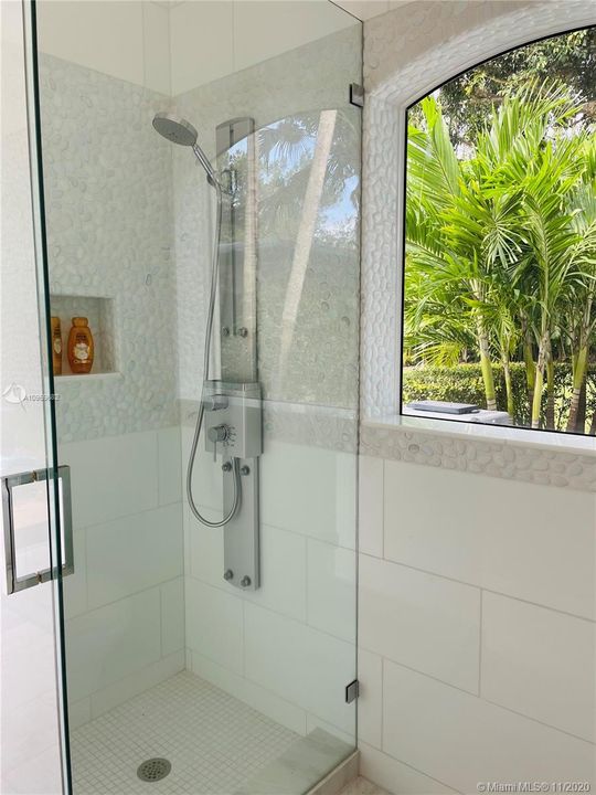 Shower located inside outdoor full bathroom