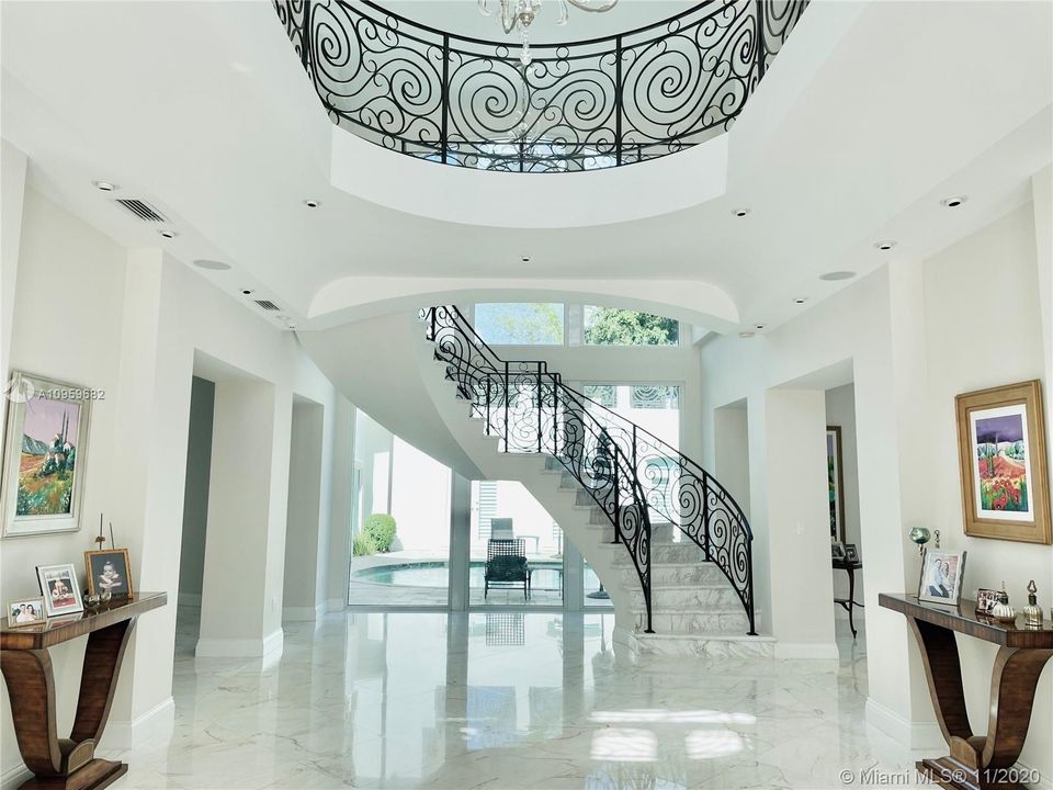 View upon Entering the Home- Custom ceilings in every room & hallways. Marble floors throughout 1st floor.